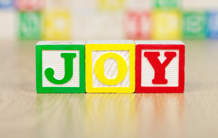 JOY Spelled Out in Colorful Alphabet Building Blocks