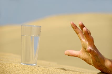 Hand reaching for water.