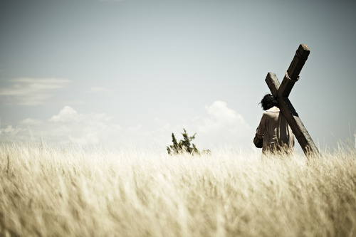 Man carrying cross